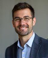 Professional headshot of Ben Carter